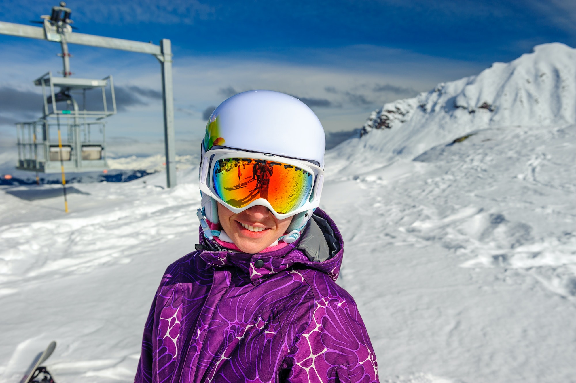 Young woman in ski goggles outdoors